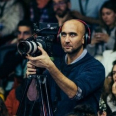 Emanuel Lew filming with a camera